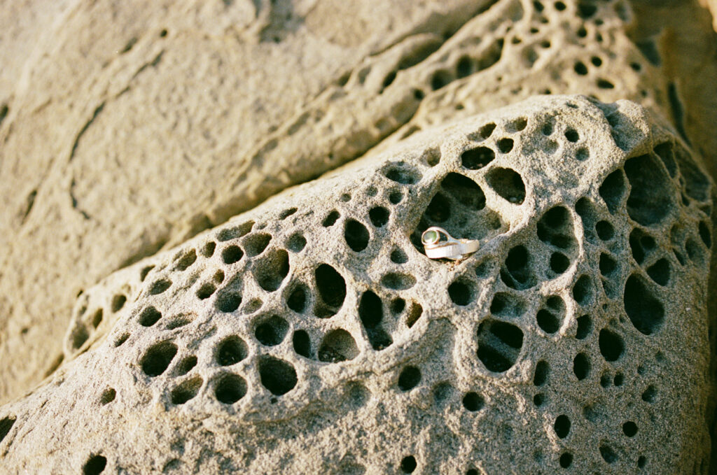 Close up photo of two rings on tafoni sandstone, taken by Skyler Maire Photography.